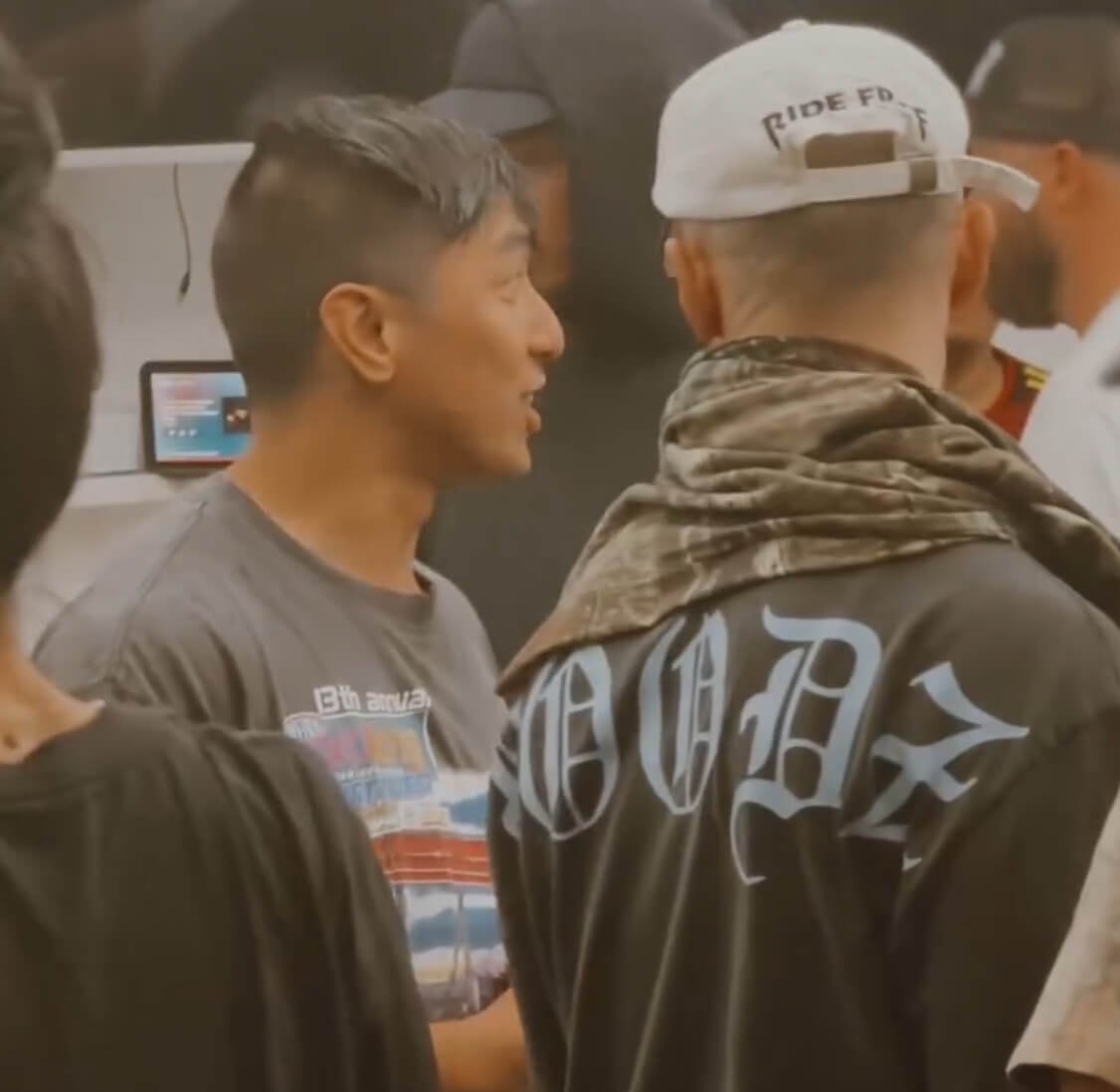 Dancers talking together indoors between battles at Sunshine Jam.